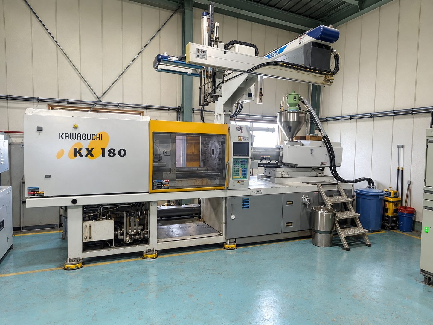 Kawaguchi KX 180 injection moulding machine with a robotic arm at the Shans factory